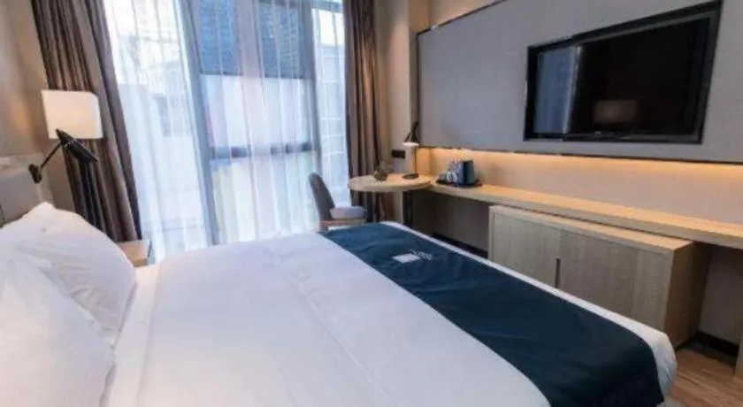 Bed in Echarm Hotel Hefei West Qilitang Metro Station