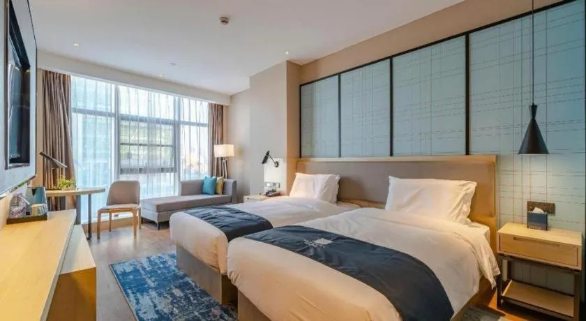 Bed in Echarm Hotel Hefei West Qilitang Metro Station