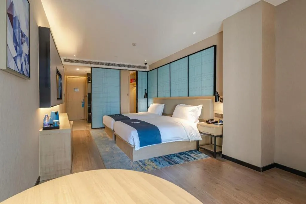 Bed in Echarm Hotel Hefei West Qilitang Metro Station