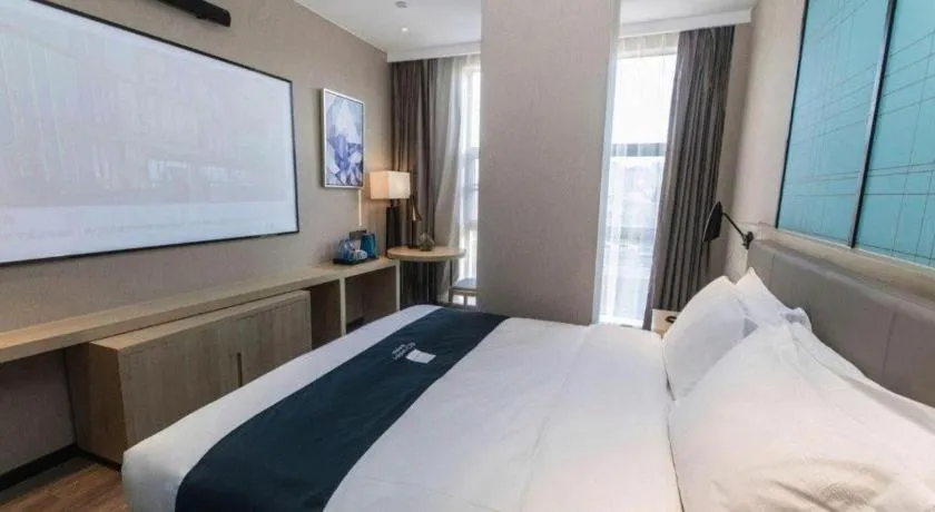 Bed in Echarm Hotel Hefei West Qilitang Metro Station