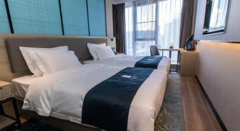 Bed in Echarm Hotel Hefei West Qilitang Metro Station