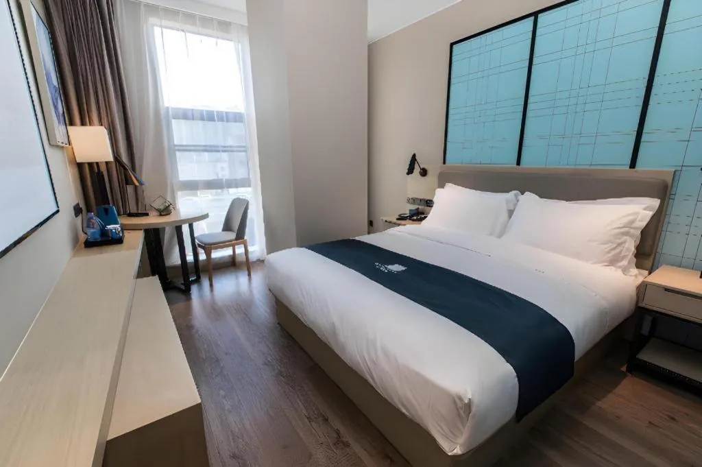 Bed in Echarm Hotel Hefei West Qilitang Metro Station