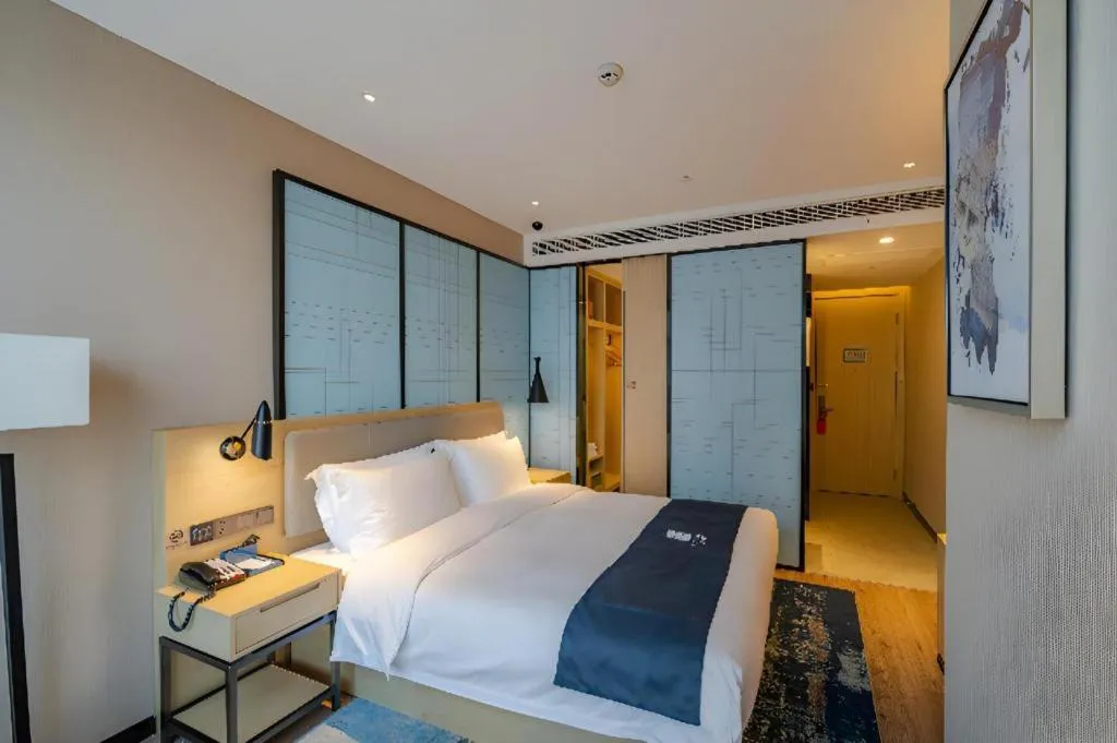 Bed in Echarm Hotel Hefei West Qilitang Metro Station
