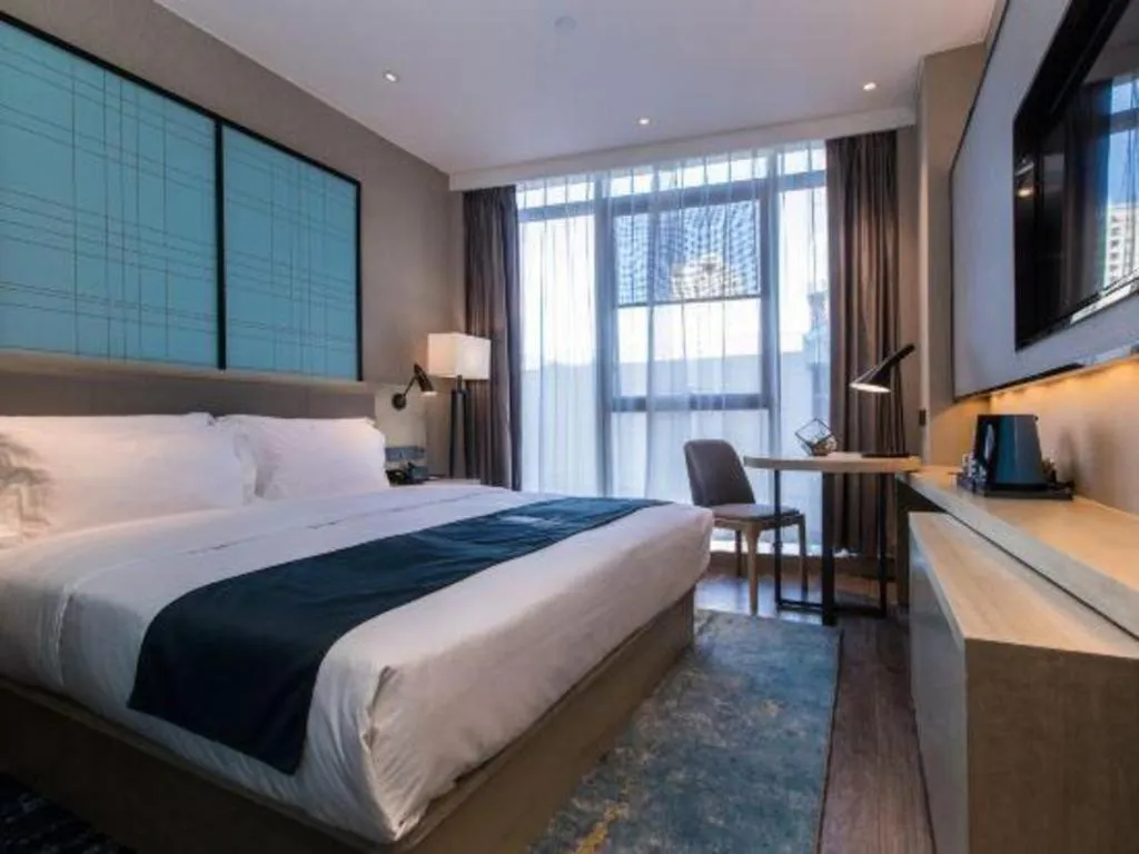 Bed in Echarm Hotel Hefei West Qilitang Metro Station