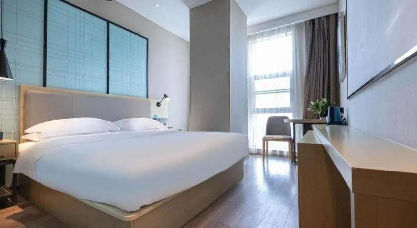 Bed in Echarm Hotel Hefei West Qilitang Metro Station