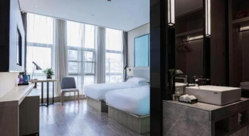 Bed in Echarm Hotel Hefei West Qilitang Metro Station