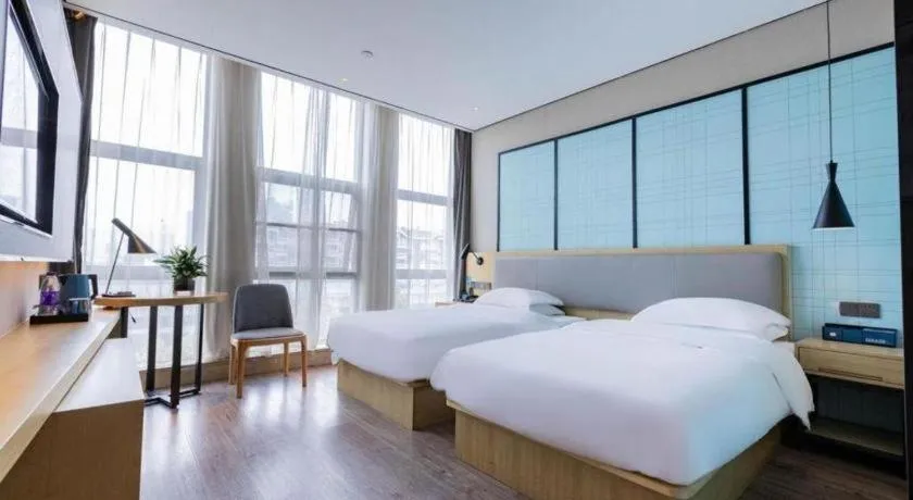 Bed in Echarm Hotel Hefei West Qilitang Metro Station