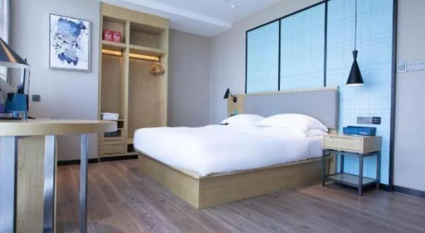 Bed in Echarm Hotel Hefei West Qilitang Metro Station