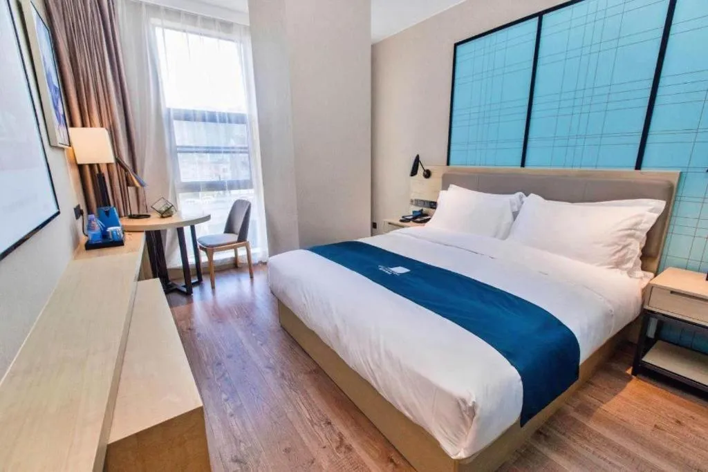 Bed in Echarm Hotel Hefei West Qilitang Metro Station