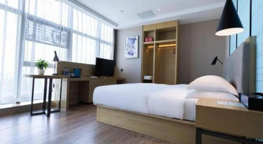 Bed in Echarm Hotel Hefei West Qilitang Metro Station