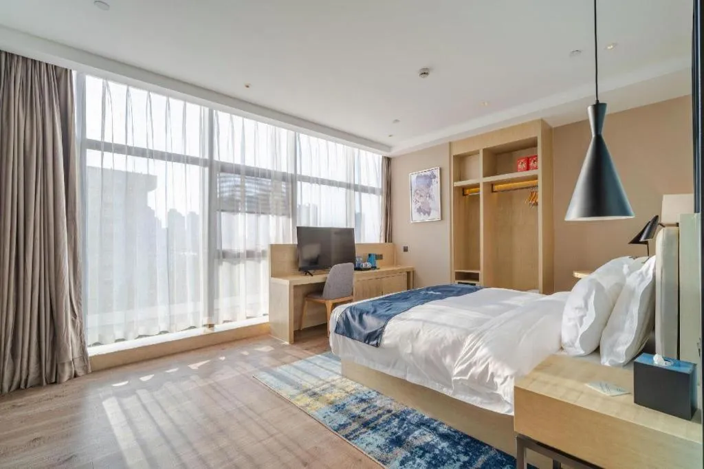 Bed in Echarm Hotel Hefei West Qilitang Metro Station