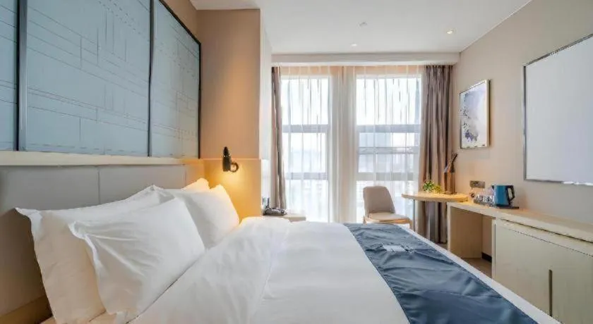 Bed in Echarm Hotel Hefei West Qilitang Metro Station