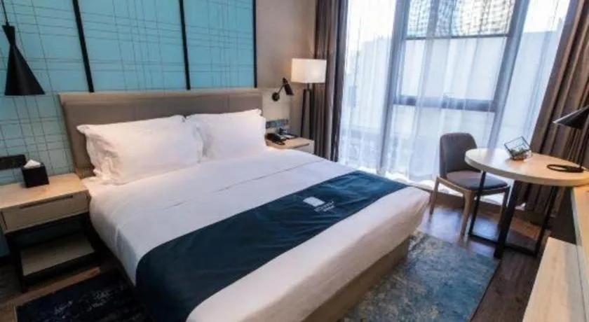 Bed in Echarm Hotel Hefei West Qilitang Metro Station