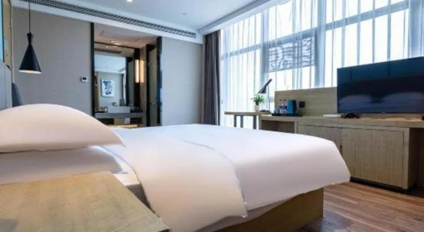 Bed in Echarm Hotel Hefei West Qilitang Metro Station