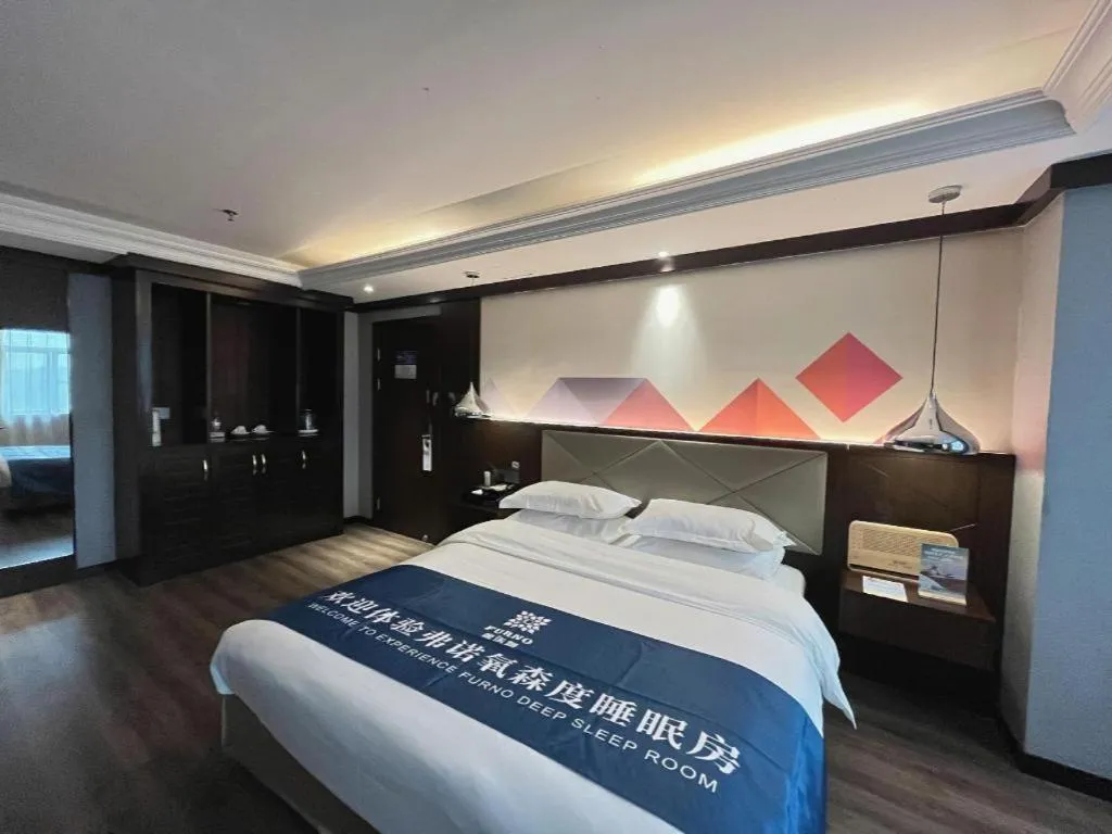 Bed in Borrman Hotel Zhongshan Henglan Xiyong