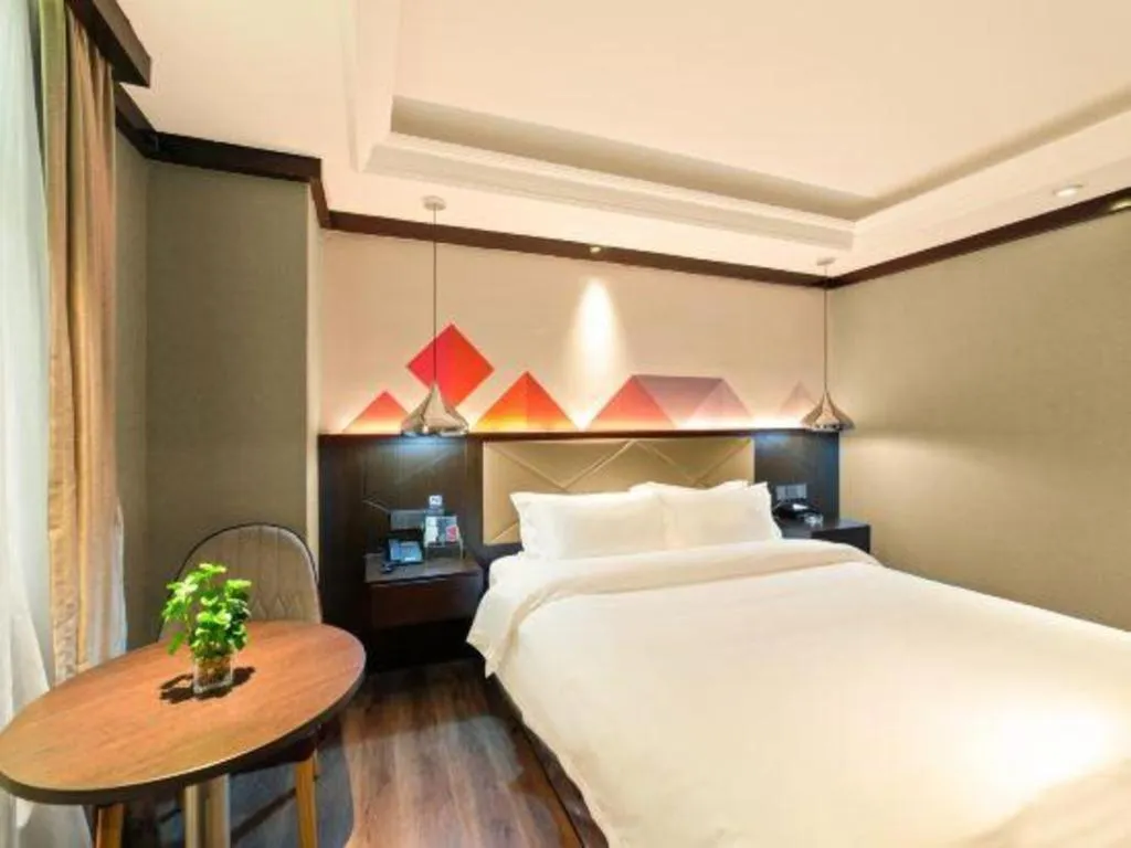 Bed in Borrman Hotel Zhongshan Henglan Xiyong