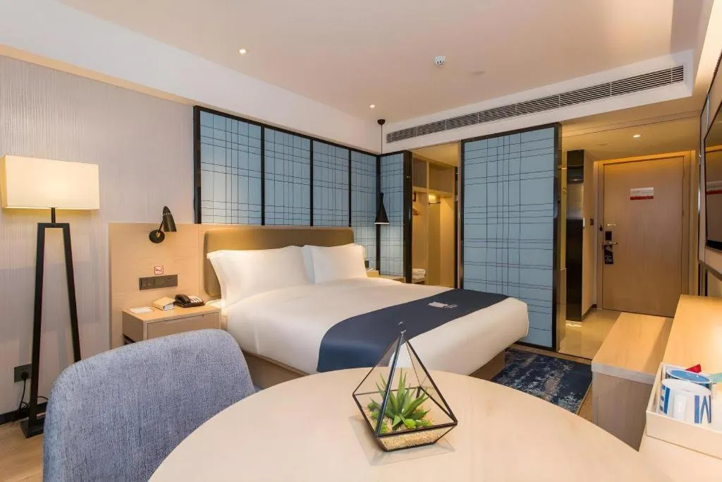 Bed in Echarm Hotel Changsha Xiangya Fushan