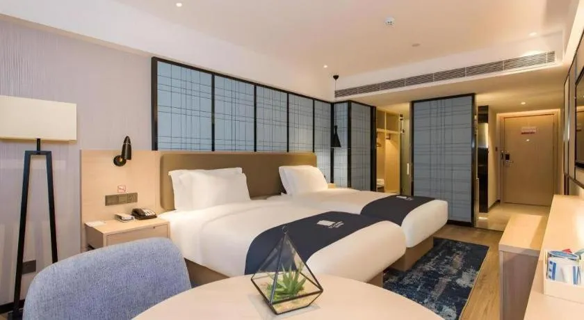 Bed in Echarm Hotel Changsha Xiangya Fushan