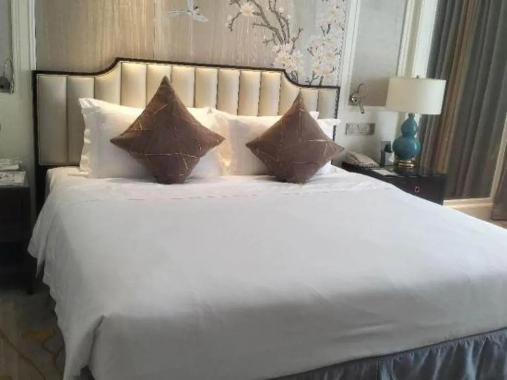 Bed in Ming Guan Hotel