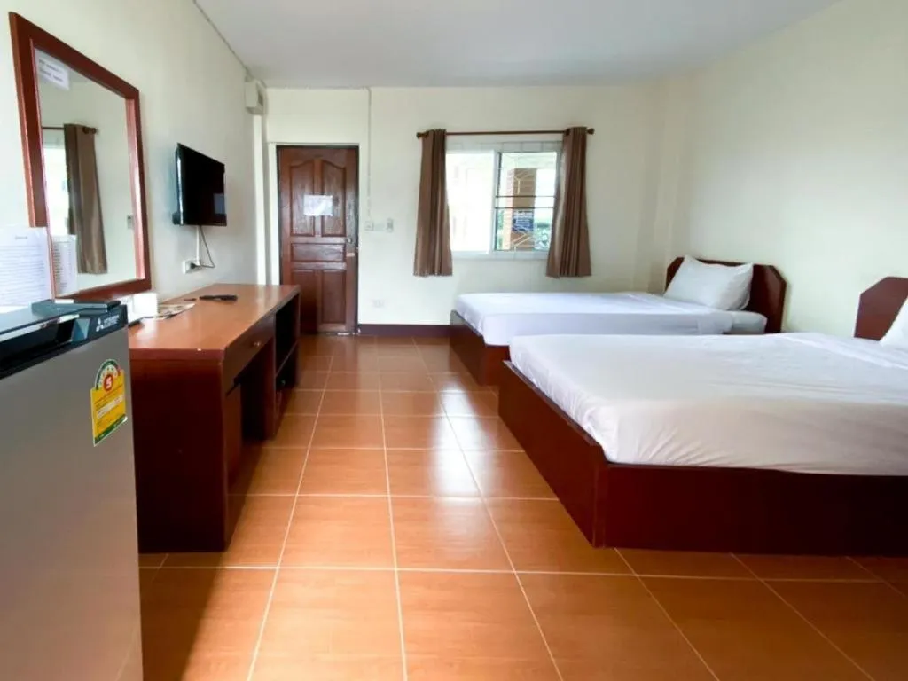 Bed in SC Palace Chiangrai Hotel