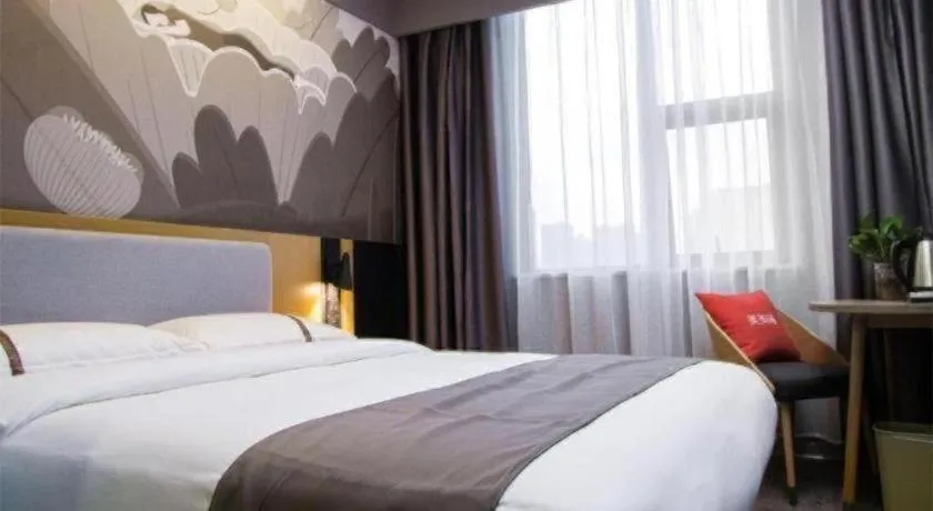 Bed in Thank Inn Hotel Guangxi Hechi Yizhou Sankeshu