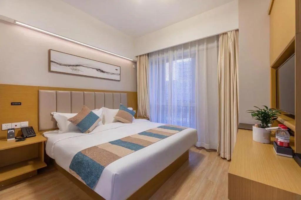 Bed in VX Hotel Wuxi Xinwu District Executive Center Wanda Plaza