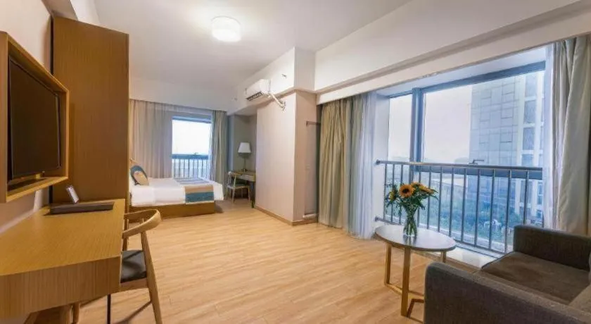 Bed in VX Hotel Wuxi Xinwu District Executive Center Wanda Plaza