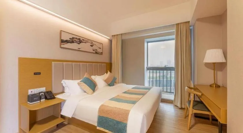 Bed in VX Hotel Wuxi Xinwu District Executive Center Wanda Plaza