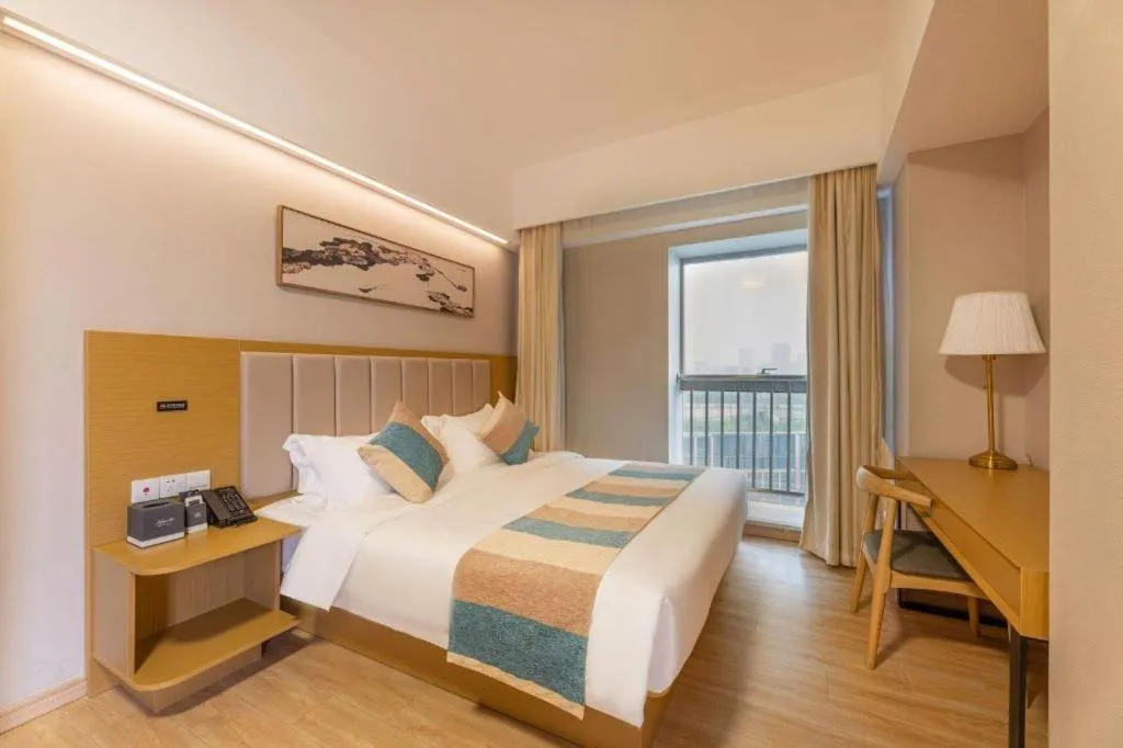 Bed in VX Hotel Wuxi Xinwu District Executive Center Wanda Plaza