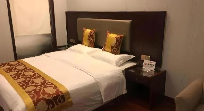 Bed in Shell Hotel Wuxi Jiangyin Zhutang Town