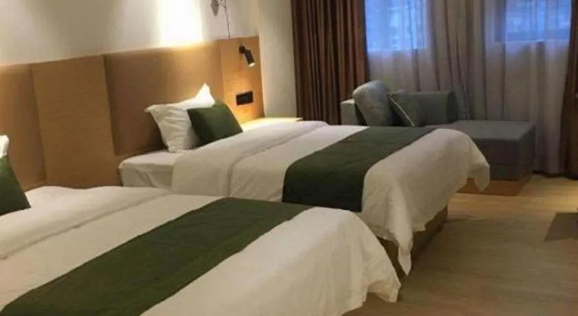 Bed in Green Tree Inn Guangxi Wuzhou 2nd Xinxing Road Liangguang Market