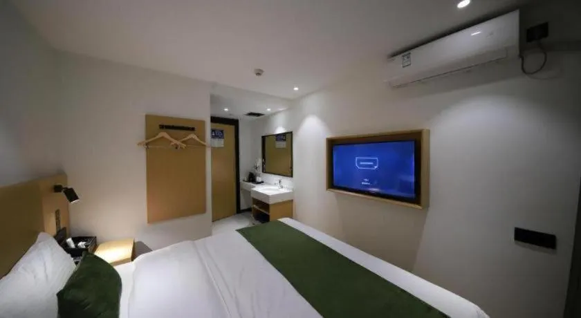 Bed in Green Tree Inn Guangxi Wuzhou 2nd Xinxing Road Liangguang Market