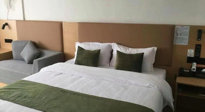 Bed in Green Tree Inn Guangxi Wuzhou 2nd Xinxing Road Liangguang Market