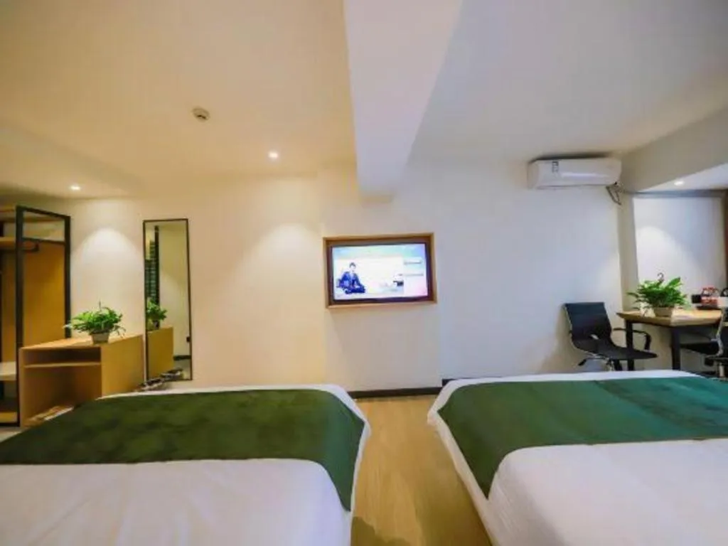 Bed in Green Tree Inn Guangxi Wuzhou 2nd Xinxing Road Liangguang Market