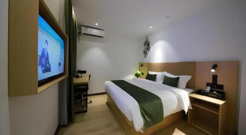 Bed in Green Tree Inn Guangxi Wuzhou 2nd Xinxing Road Liangguang Market