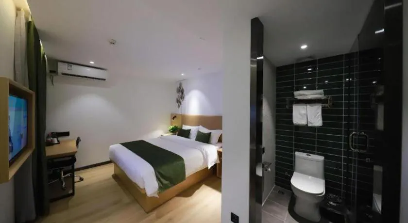 Bed in Green Tree Inn Guangxi Wuzhou 2nd Xinxing Road Liangguang Market