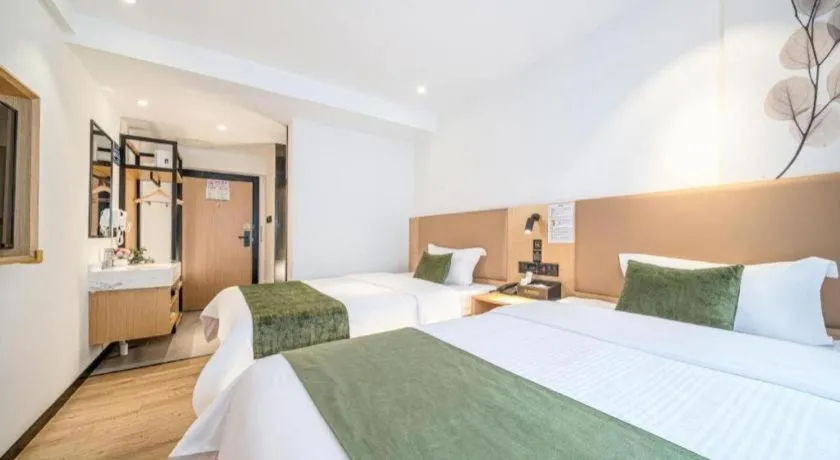 Bed in Green Tree Inn Guangxi Wuzhou 2nd Xinxing Road Liangguang Market
