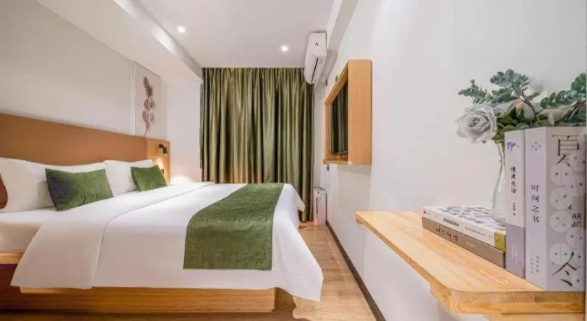 Bed in Green Tree Inn Guangxi Wuzhou 2nd Xinxing Road Liangguang Market