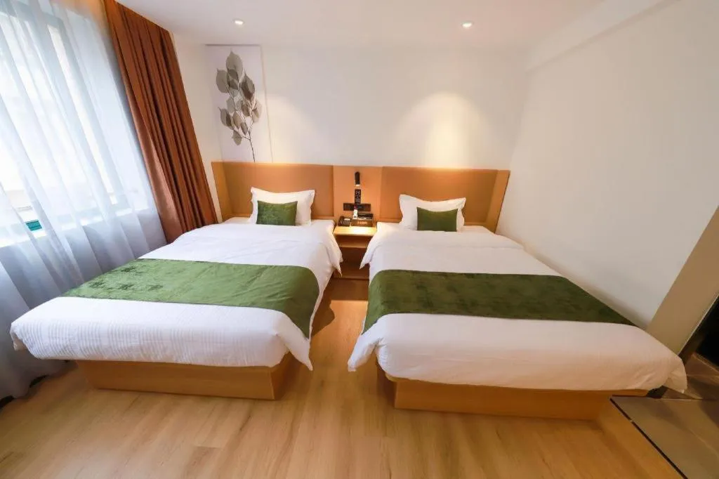 Bed in Green Tree Inn Guangxi Wuzhou 2nd Xinxing Road Liangguang Market