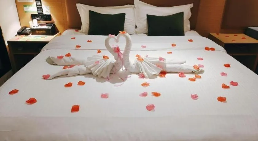 Bed in Green Tree Inn Guangxi Wuzhou 2nd Xinxing Road Liangguang Market