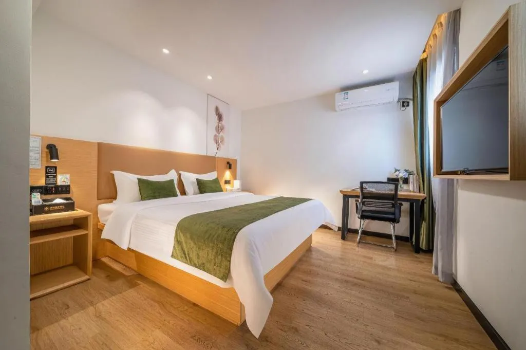 Bed in Green Tree Inn Guangxi Wuzhou 2nd Xinxing Road Liangguang Market