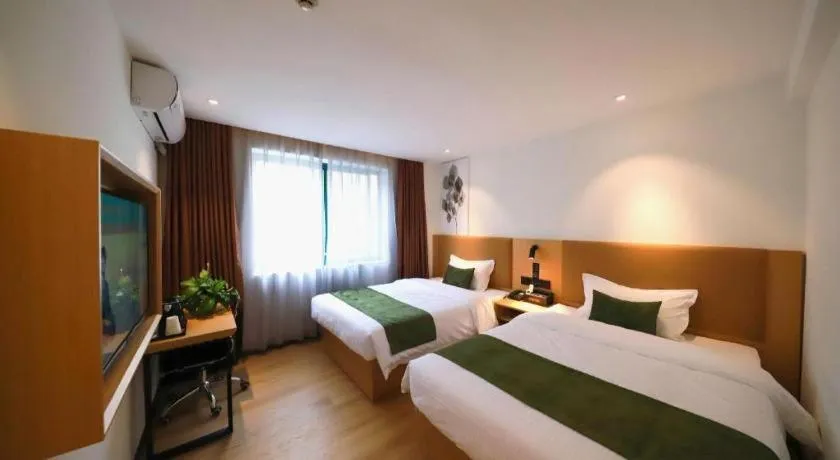Bed in Green Tree Inn Guangxi Wuzhou 2nd Xinxing Road Liangguang Market
