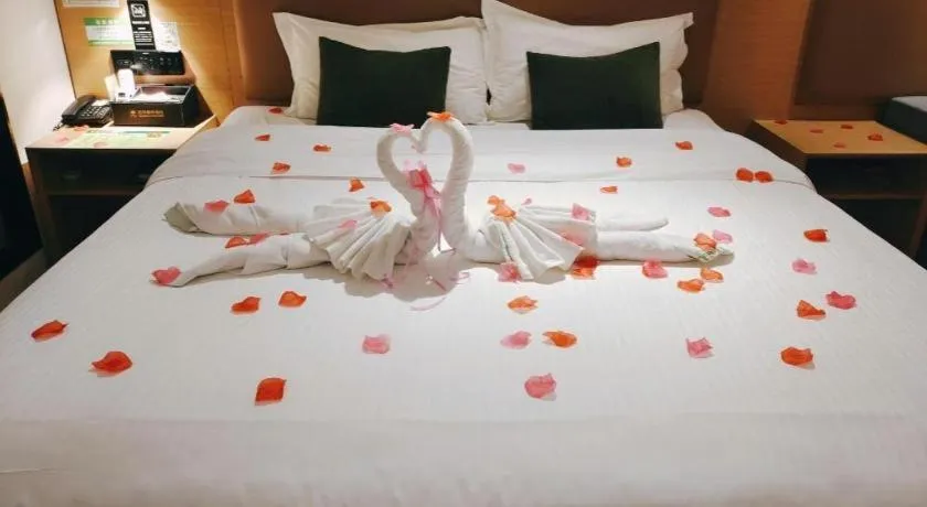 Bed in Green Tree Inn Guangxi Wuzhou 2nd Xinxing Road Liangguang Market