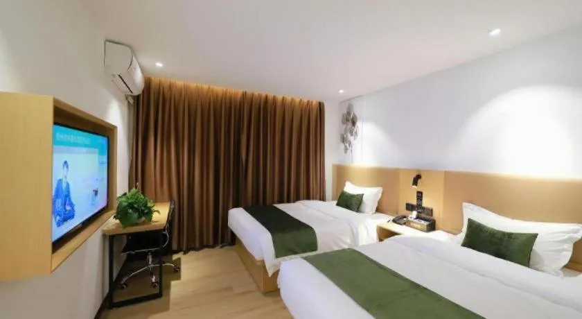 Bed in Green Tree Inn Guangxi Wuzhou 2nd Xinxing Road Liangguang Market