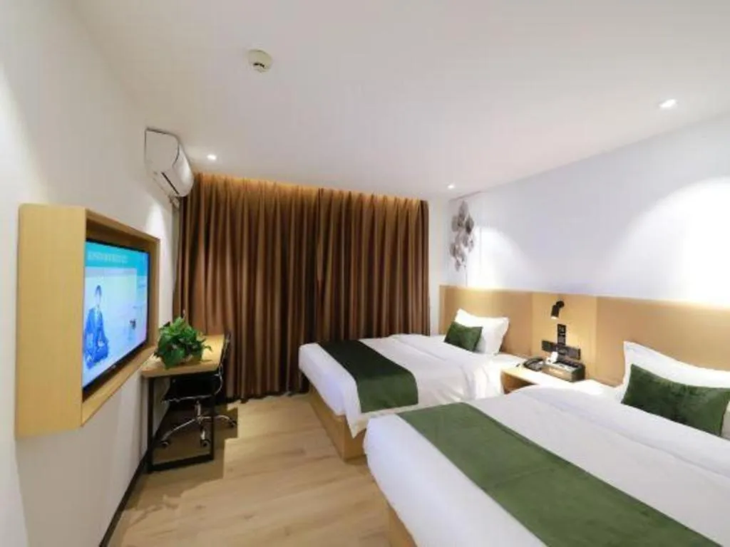Bed in Green Tree Inn Guangxi Wuzhou 2nd Xinxing Road Liangguang Market