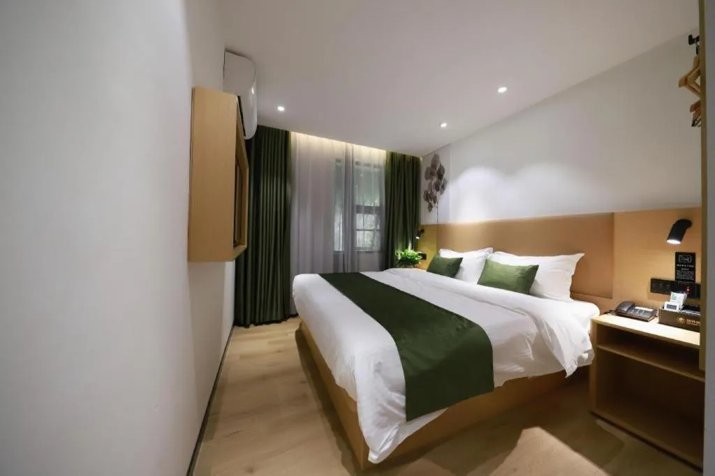 Bed in Green Tree Inn Guangxi Wuzhou 2nd Xinxing Road Liangguang Market
