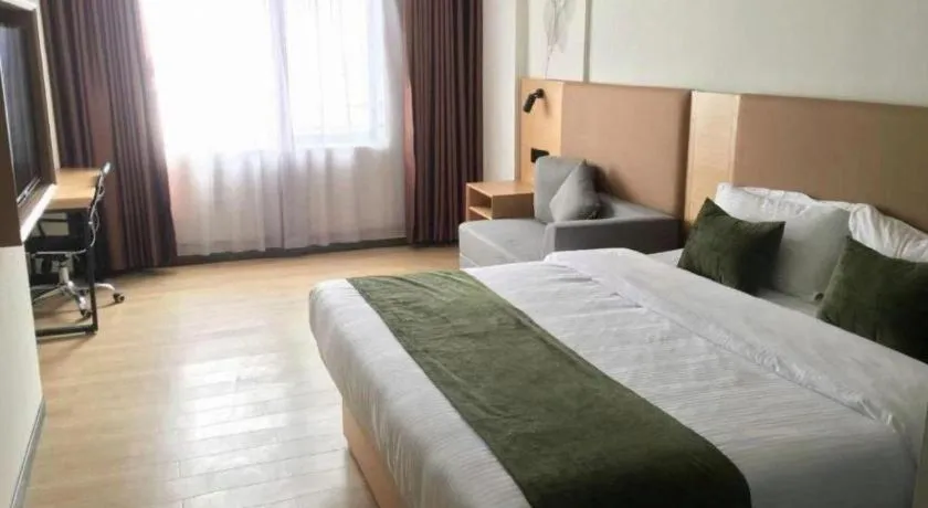 Bed in Green Tree Inn Guangxi Wuzhou 2nd Xinxing Road Liangguang Market