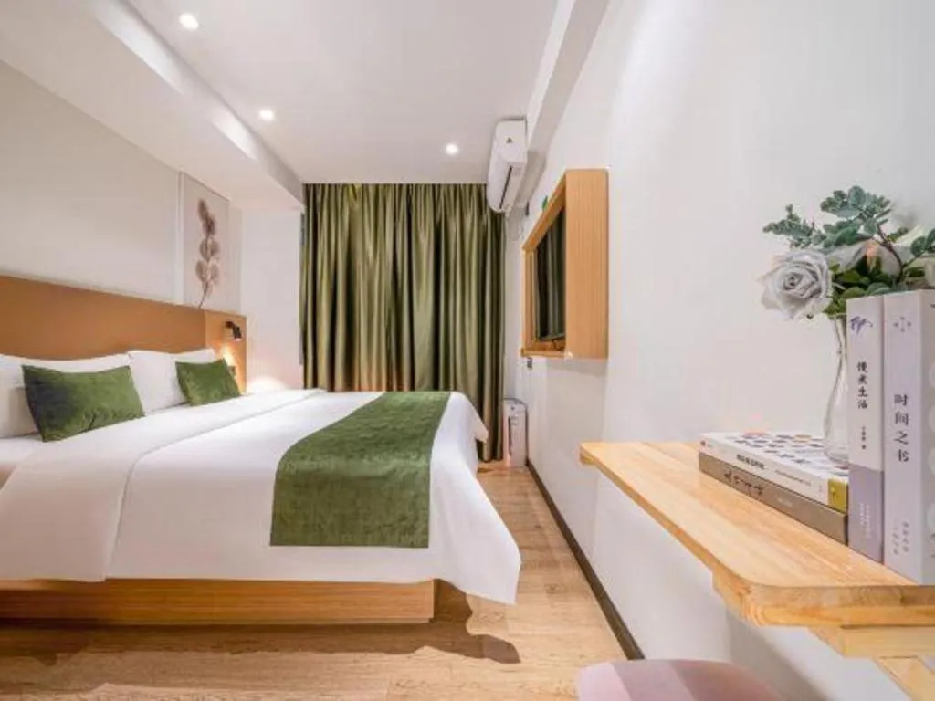 Bed in Green Tree Inn Guangxi Wuzhou 2nd Xinxing Road Liangguang Market