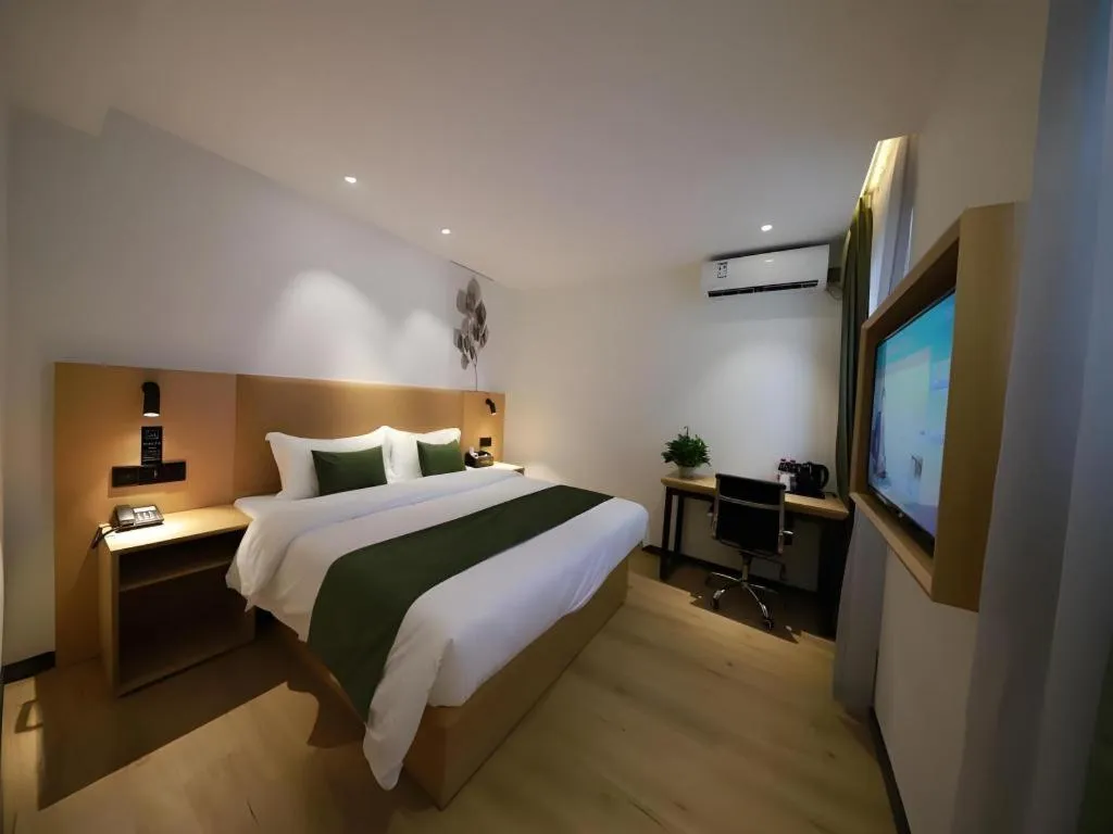 Bed in Green Tree Inn Guangxi Wuzhou 2nd Xinxing Road Liangguang Market