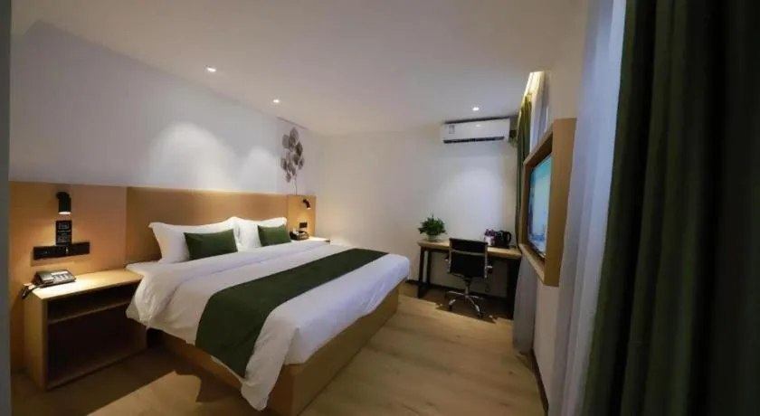 Bed in Green Tree Inn Guangxi Wuzhou 2nd Xinxing Road Liangguang Market